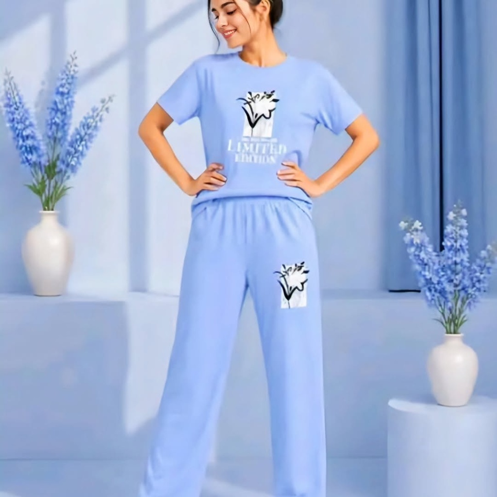 A light blue loungewear set features a graphic t - shirt and matching relaxed - fit wide - leg trousers, available many colors (S)